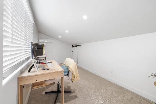 a view of a backyard with couches table and chairs potted plants and palm tree