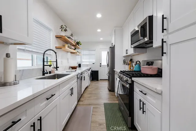 a bathroom with a granite countertop toilet sink and shower