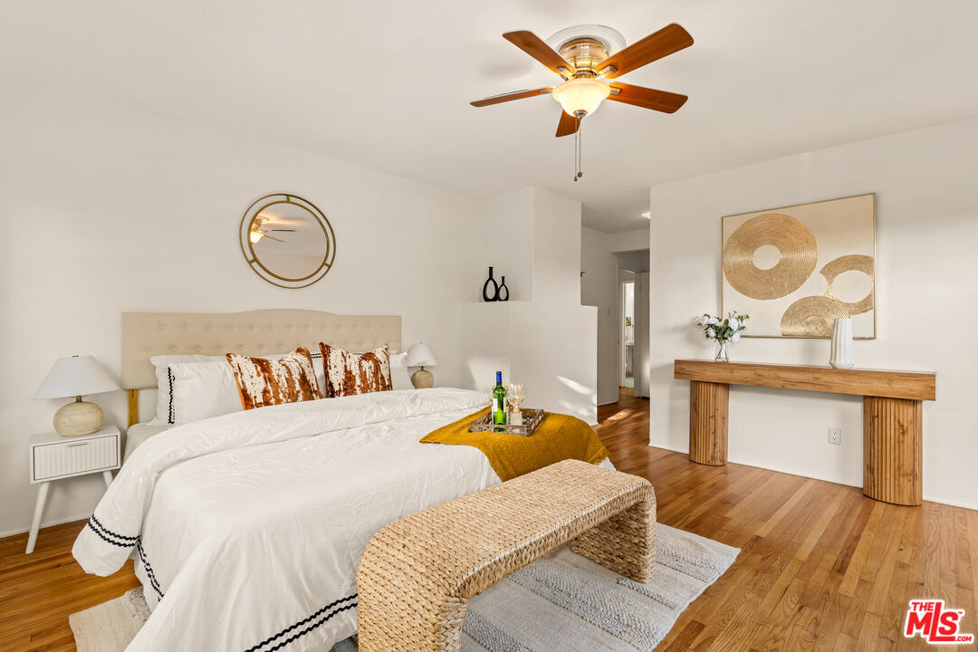 1100 Victoria Avenue Venice, CA 90291 - Photo 16 of 30 a bedroom with a bed and wooden floor