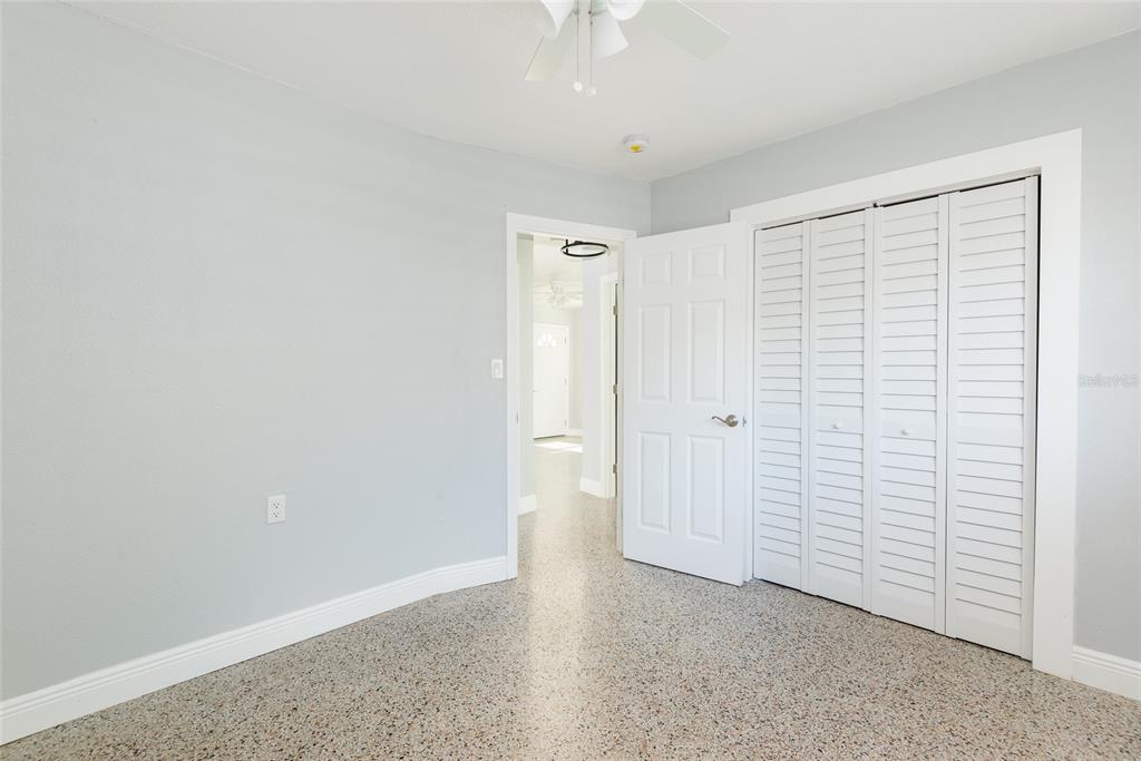 13248 4th Street East Madeira Beach, FL 33708 - Photo 29 of 47 wooden floor in an empty room