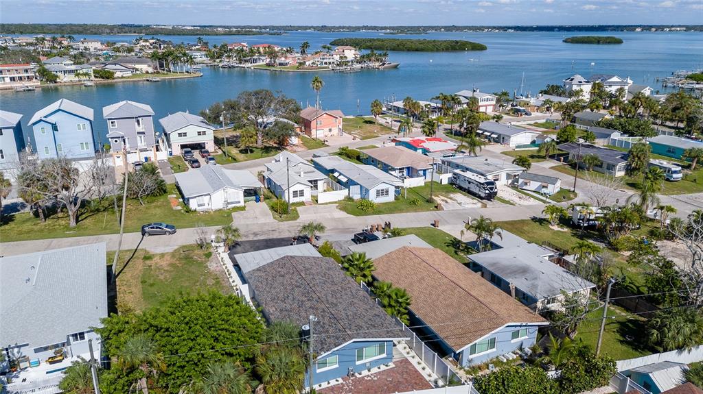 13248 4th Street East Madeira Beach, FL 33708 - Photo 37 of 47 an aerial view of lake and residential houses with outdoor space