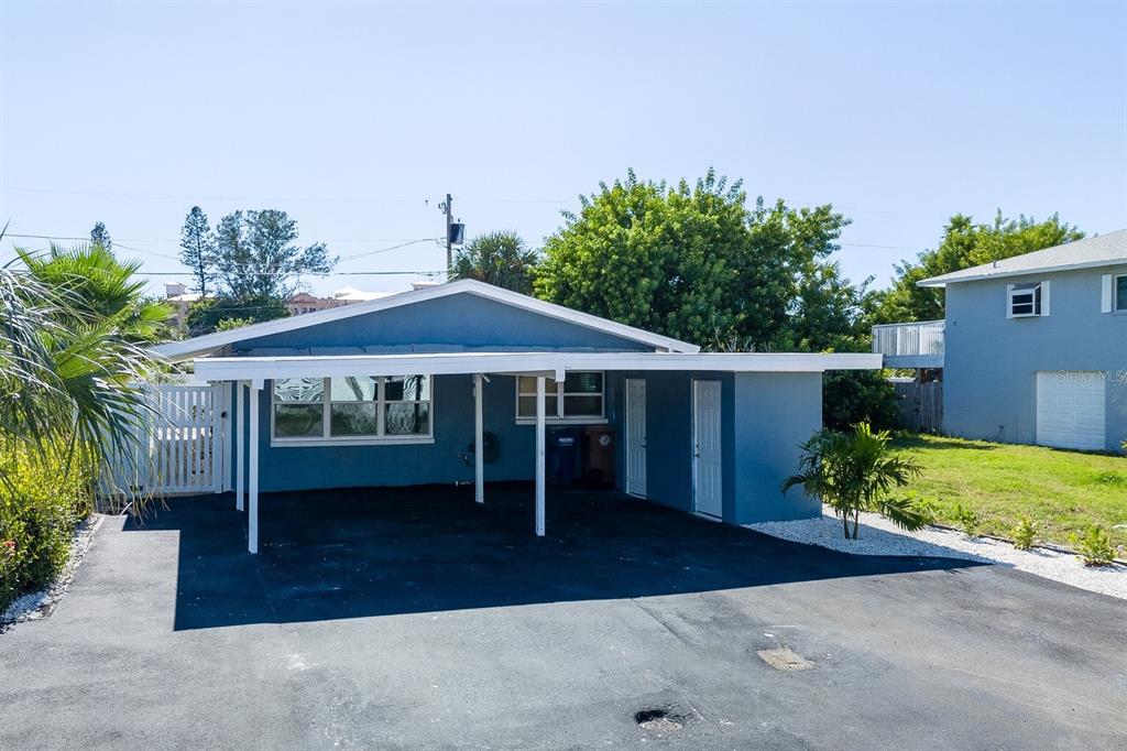 13248 4th Street East Madeira Beach, FL 33708 - Photo 47 of 47 a view of a house with backyard and a garden