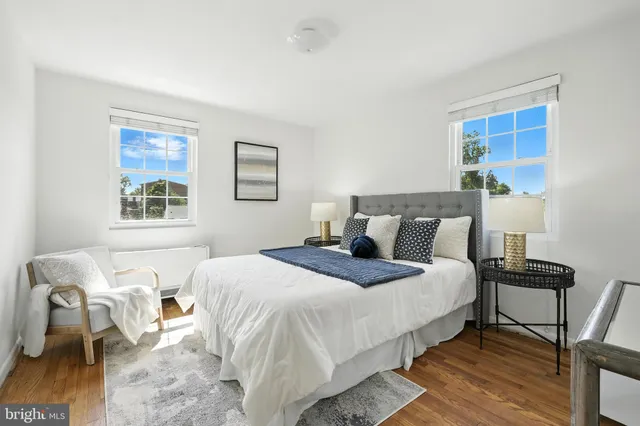 a bedroom with bed and a window