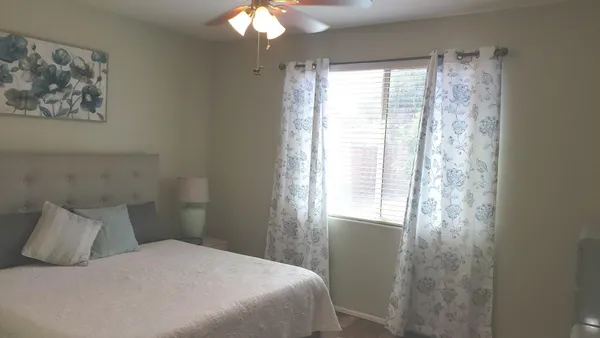a bathroom with a toilet sink and vanity