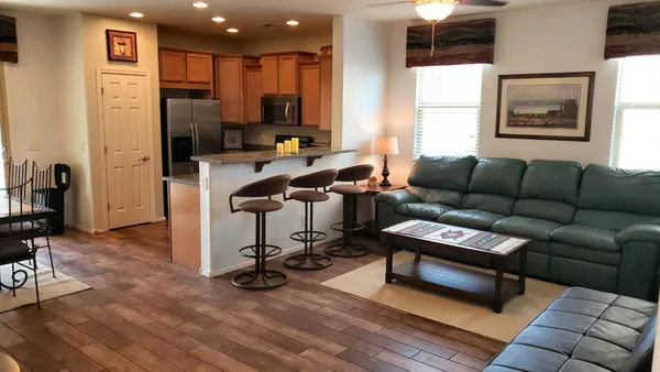 a view of a livingroom with workspace and a couch