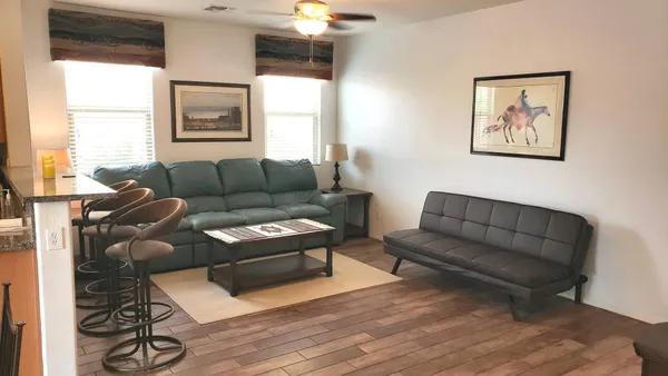 a living room with furniture and a large window