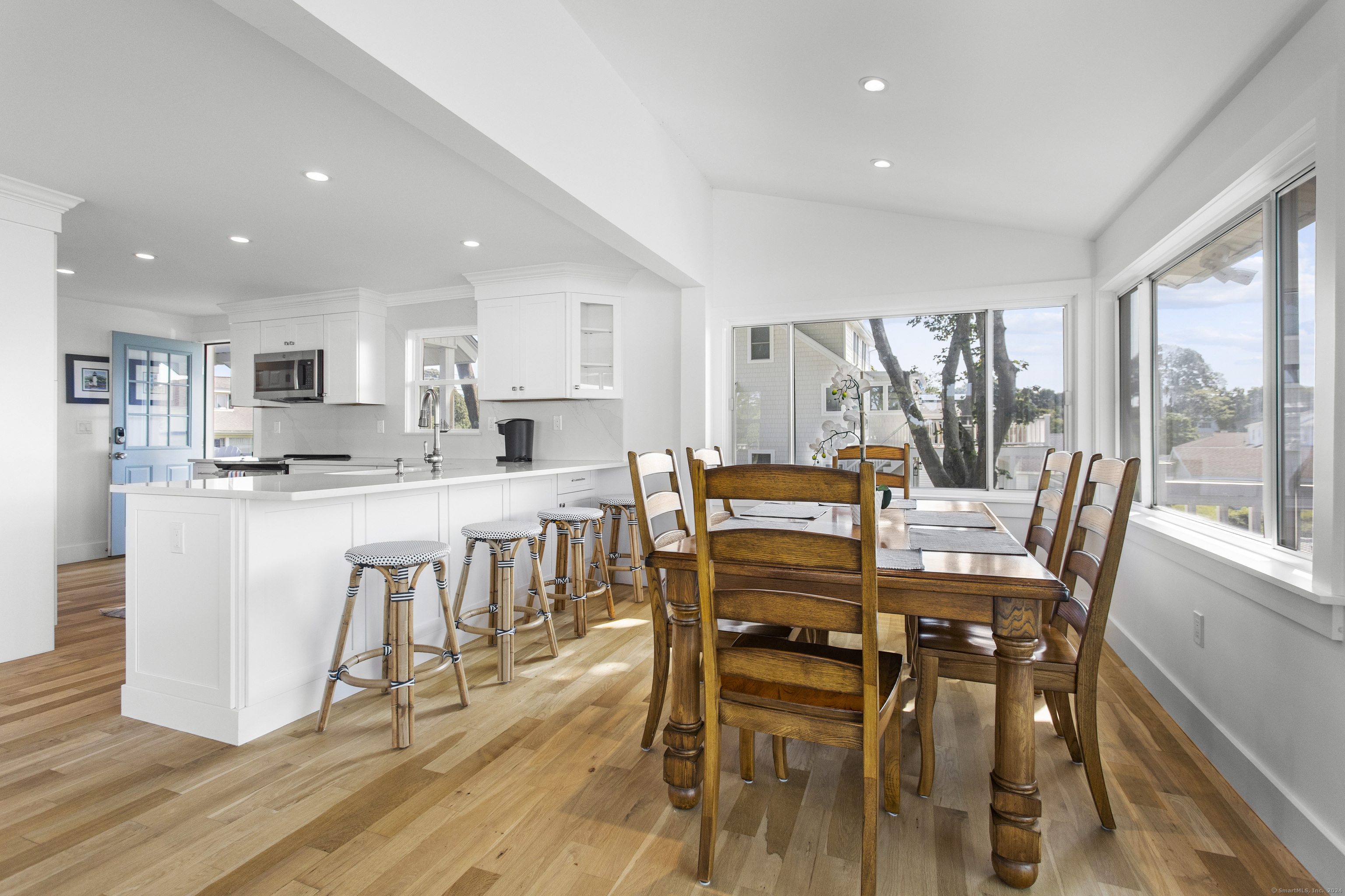 15 Cottage Road Old Lyme, CT 06371 - Photo 11 of 26 a view of a dining room with furniture and wooden floor