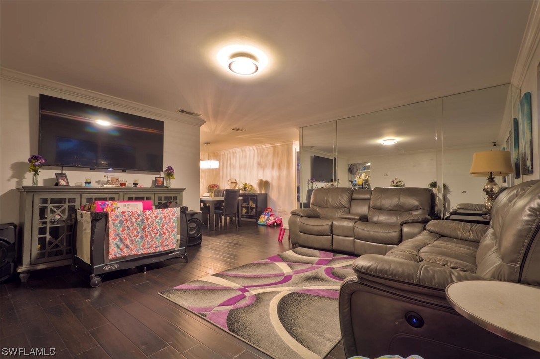 9180 Mandarin Road Fort Myers, FL 33967 - Photo 3 of 26 a living room with furniture and a flat screen tv