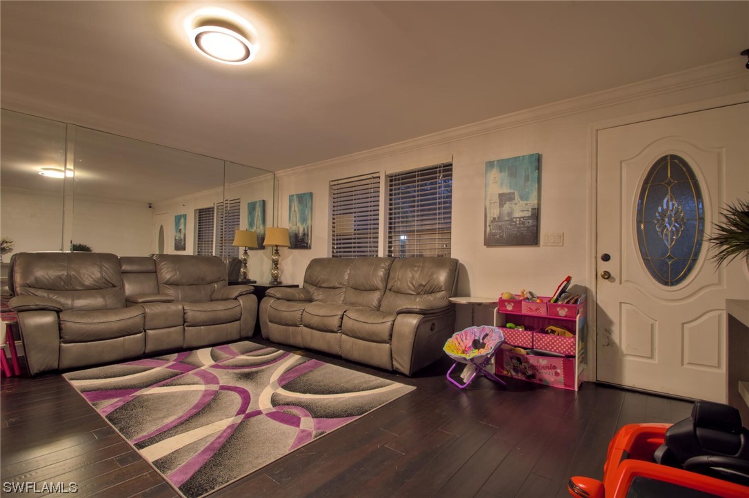 9180 Mandarin Road Fort Myers, FL 33967 - Photo 4 of 26 a living room with furniture a rug and a window