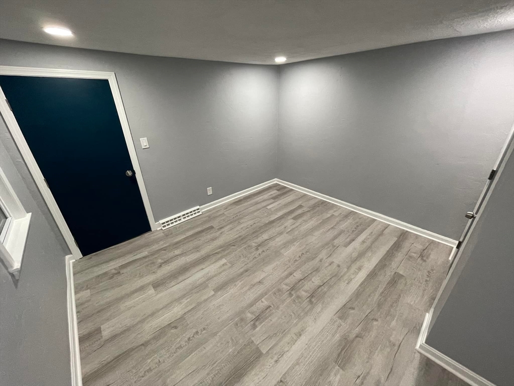 7 Coolidge Street Hudson, MA 01749 - Photo 11 of 40 a view of empty room with wooden floor