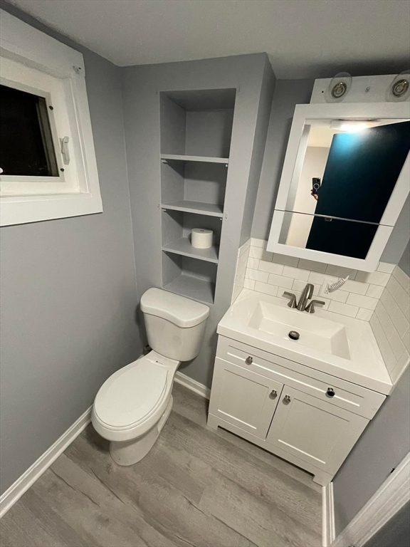 7 Coolidge Street Hudson, MA 01749 - Photo 13 of 40 a bathroom with a toilet sink and mirror