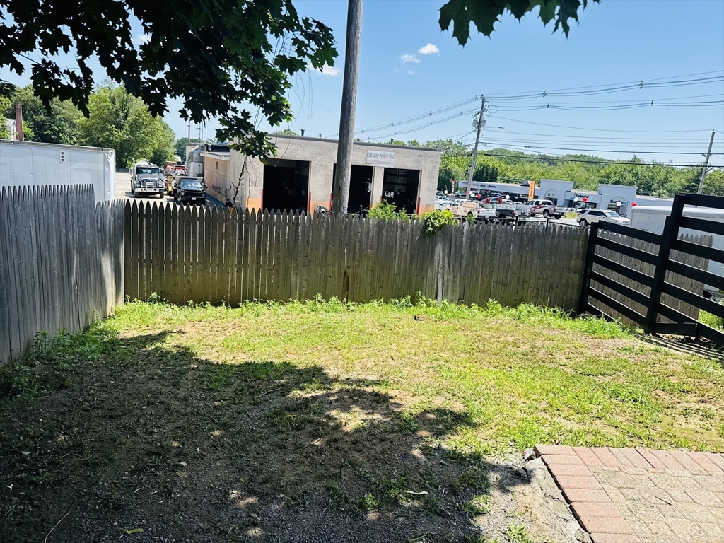7 Coolidge Street Hudson, MA 01749 - Photo 31 of 40 a view of a house with backyard and sitting area