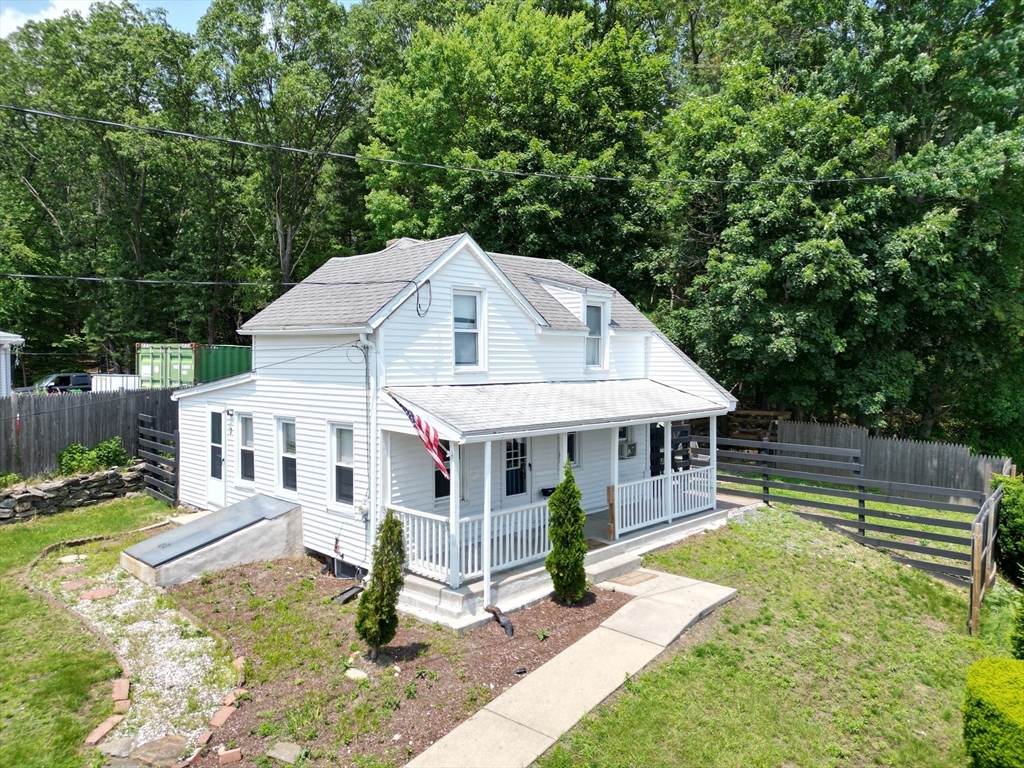 7 Coolidge Street Hudson, MA 01749 - Photo 4 of 40 a view of a house with a yard balcony and slide