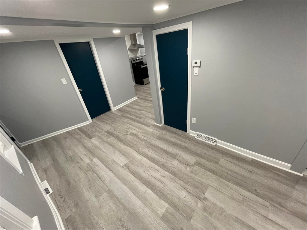 7 Coolidge Street Hudson, MA 01749 - Photo 6 of 40 a view of hallway with wooden floor