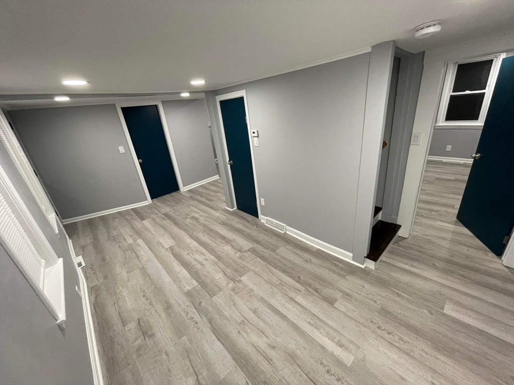 7 Coolidge Street Hudson, MA 01749 - Photo 9 of 40 a view of hallway with wooden floor