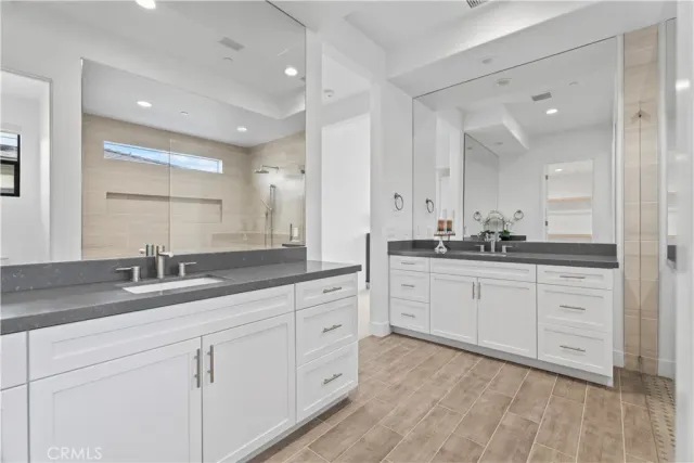 a view of a house with swimming pool and sitting area