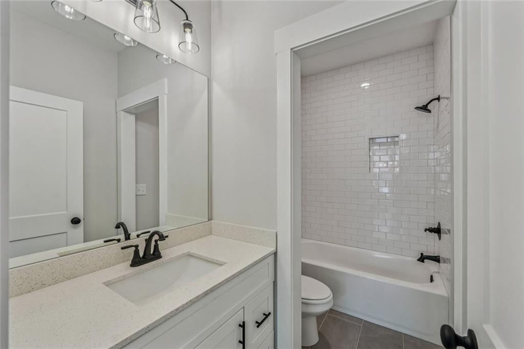 1179 Booker Avenue Southwest Atlanta, GA 30310 - Photo 25 of 54 a bathroom with a sink a toilet and shower