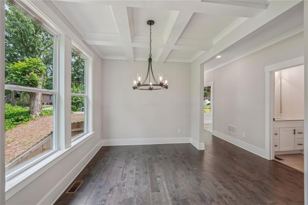 1179 Booker Avenue Southwest Atlanta, GA 30310 - Photo 4 of 54 a view of empty room with wooden floor and fan
