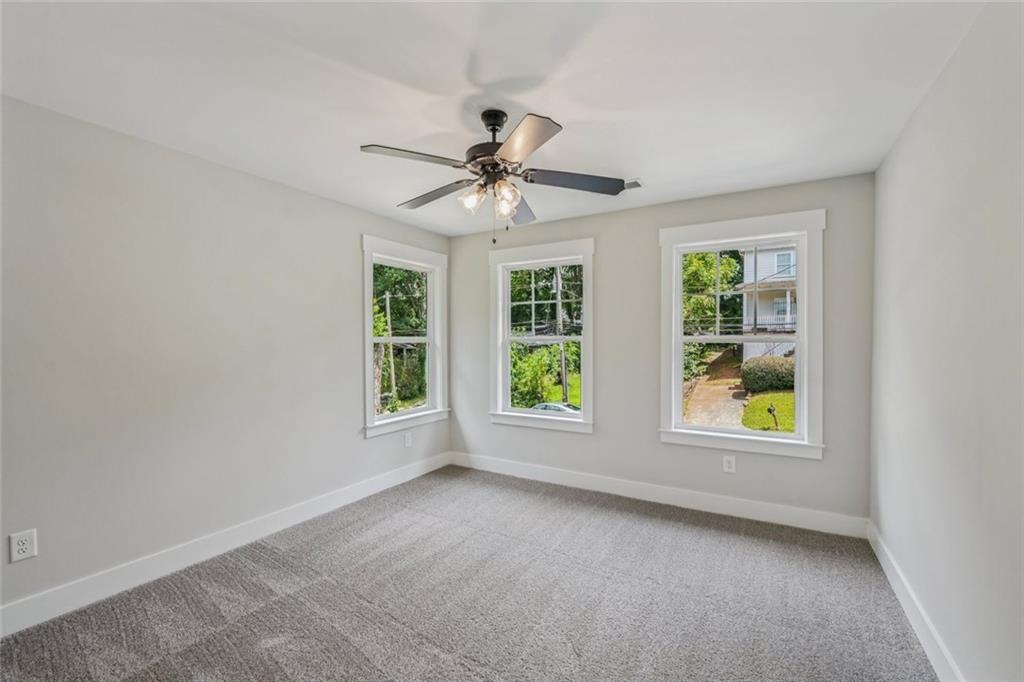 1179 Booker Avenue Southwest Atlanta, GA 30310 - Photo 41 of 54 an empty room with windows and fan