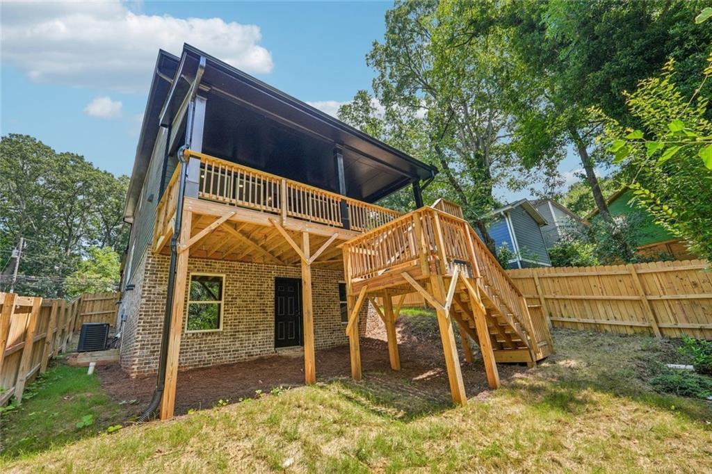 1179 Booker Avenue Southwest Atlanta, GA 30310 - Photo 48 of 54 a view of a wooden chairs and iron fence