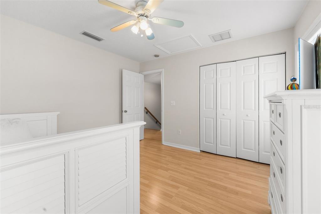 7418 White Oaks Road Alachua, FL 32615 - Photo 31 of 46 a view of an empty room with wooden floor