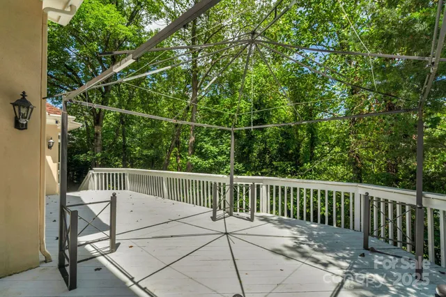 a view of a chair and table in the balcony