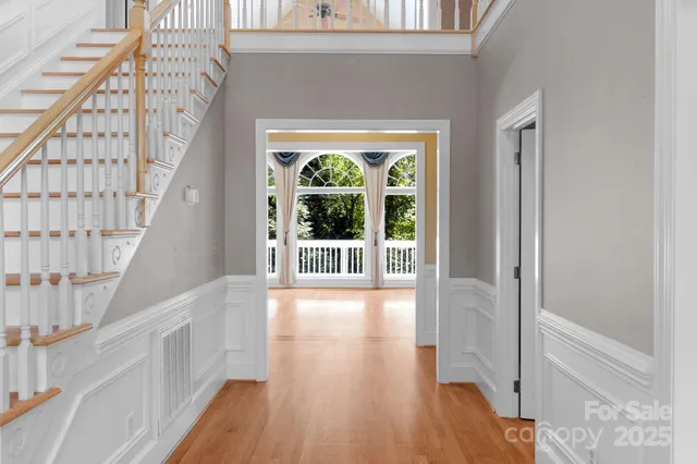 a view of an entryway with wooden floor
