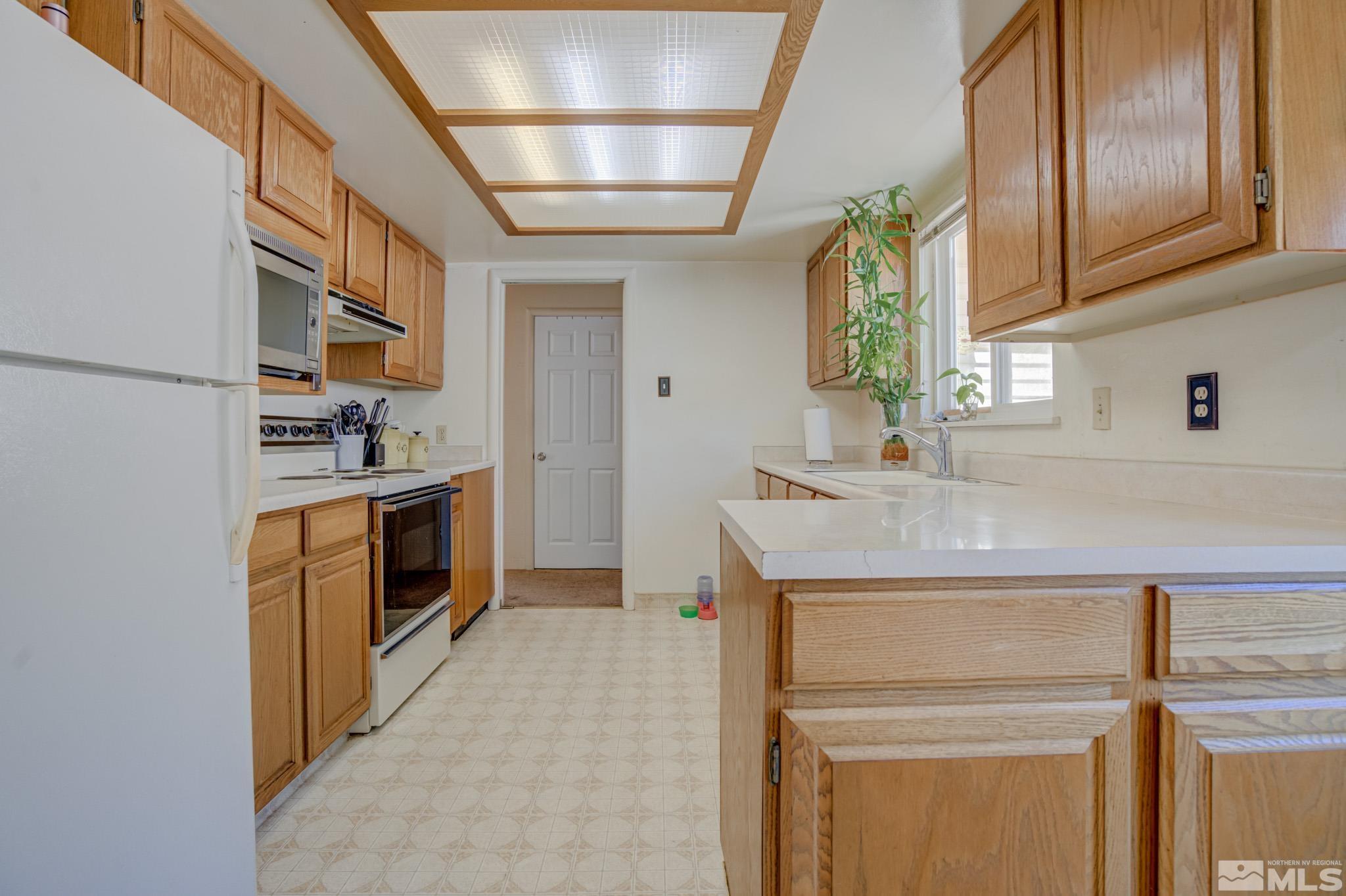 1950 Reed Street Reno, NV 89512 - Photo 10 of 20 a kitchen with a stove and a sink