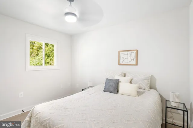 a dining room with furniture window and wooden floor