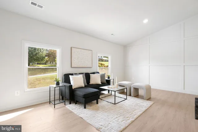a kitchen with kitchen island granite countertop a sink a center island and cabinets