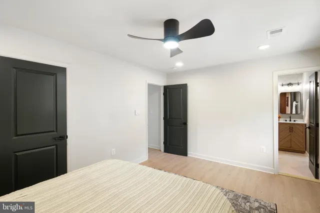 a view of hallway with wooden floor
