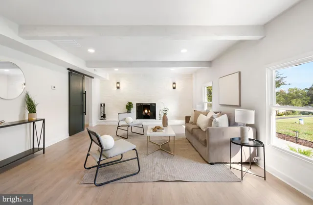 a front view of a house with potted plants