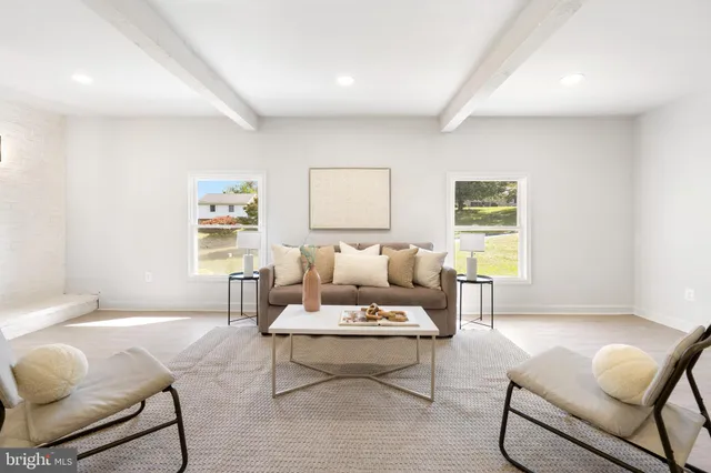 a view of a hallway with paintings on the wall