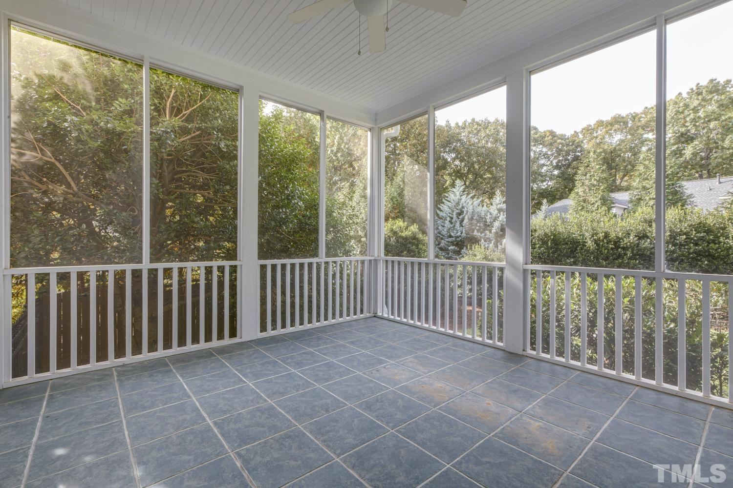 7705 Rainwater Road Raleigh, NC 27615 - Photo 13 of 18 a view of a room with wooden floor and iron fence
