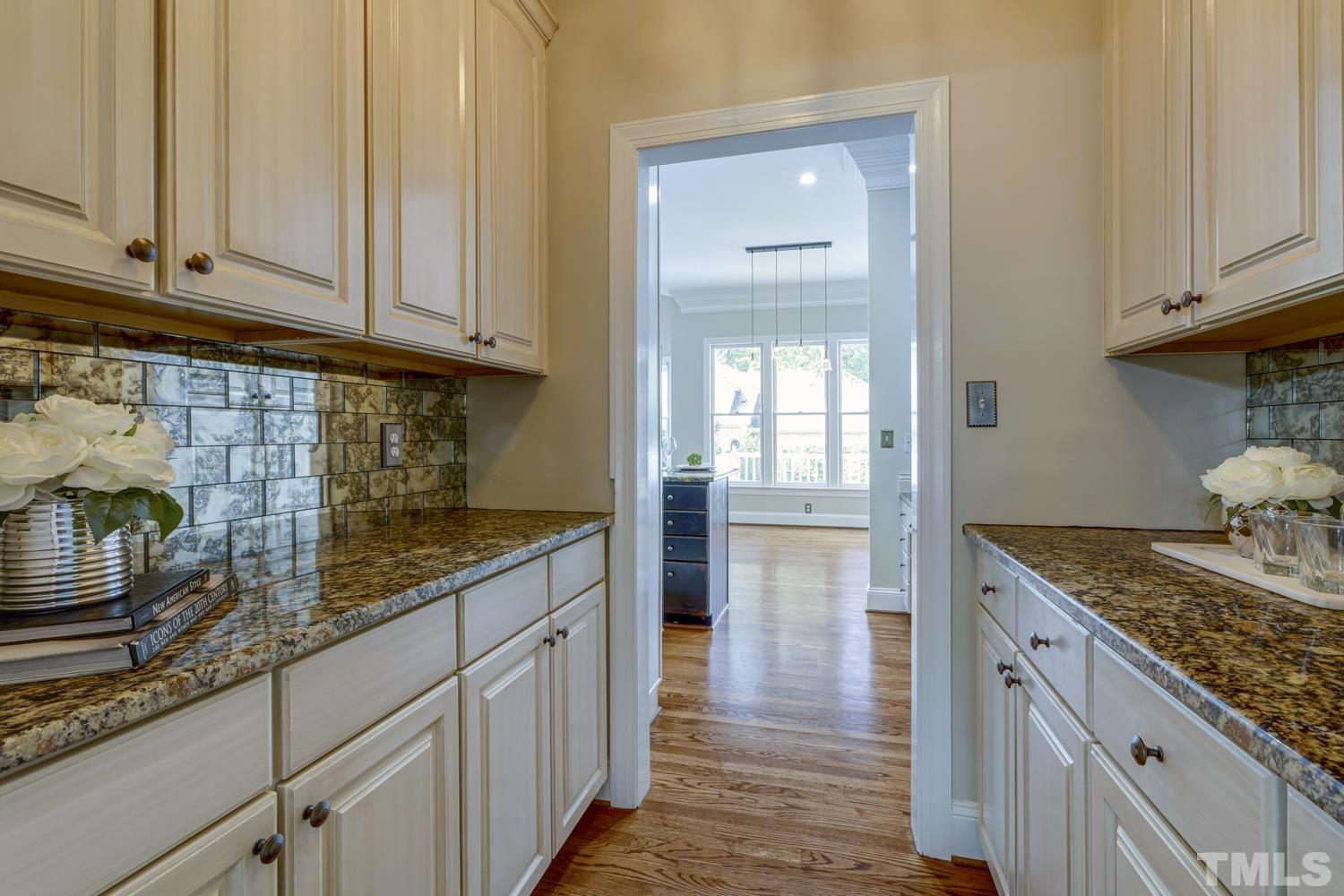7705 Rainwater Road Raleigh, NC 27615 - Photo 2 of 18 a kitchen with granite countertop a sink