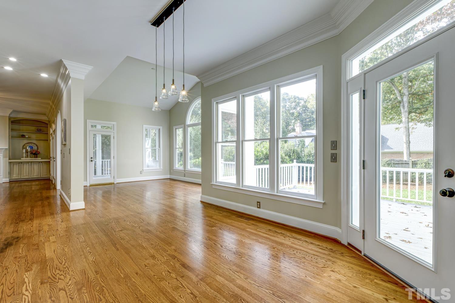 7705 Rainwater Road Raleigh, NC 27615 - Photo 4 of 18 a view of livingroom with furniture wooden floor and windows