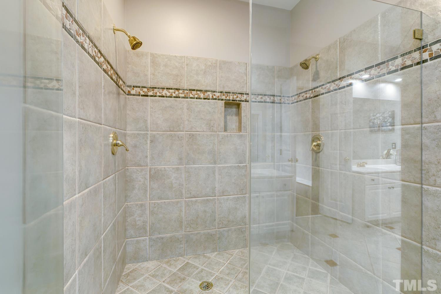 7705 Rainwater Road Raleigh, NC 27615 - Photo 7 of 18 a bathroom with a shower