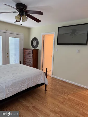 a bedroom with a bed and a table