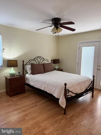 a bedroom with a bed and dresser