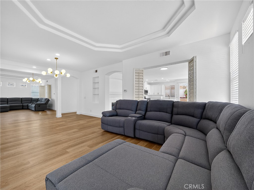 1436 Riviera Avenue Banning, CA 92220 - Photo 24 of 43 a living room with furniture and a wooden floor