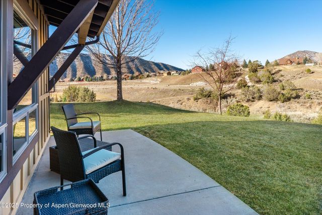 a view of a chairs in a backyard