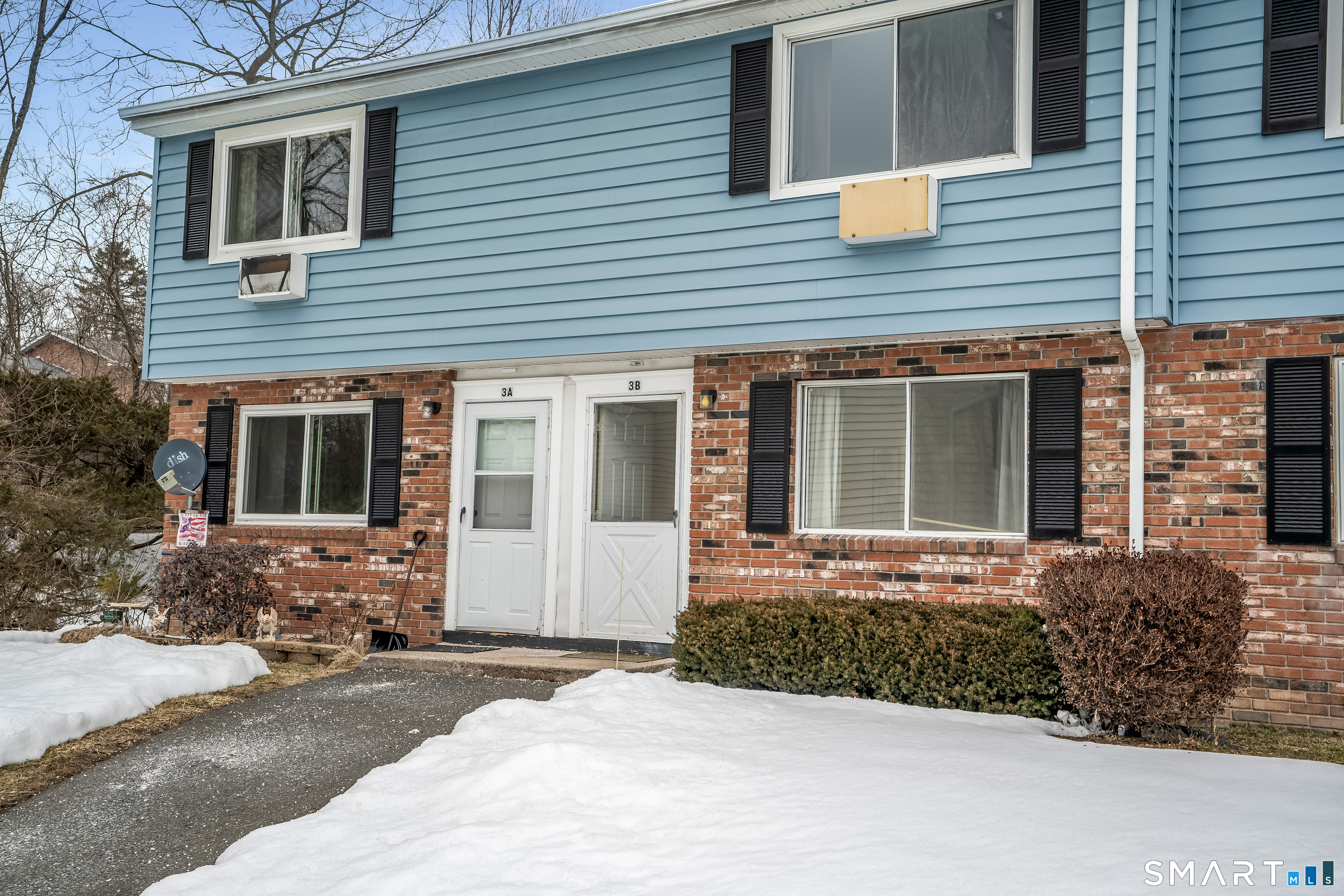 461 Spring Street, Unit 3B Naugatuck, CT 06770 - Photo 1 of 13 a front view of a house with a yard