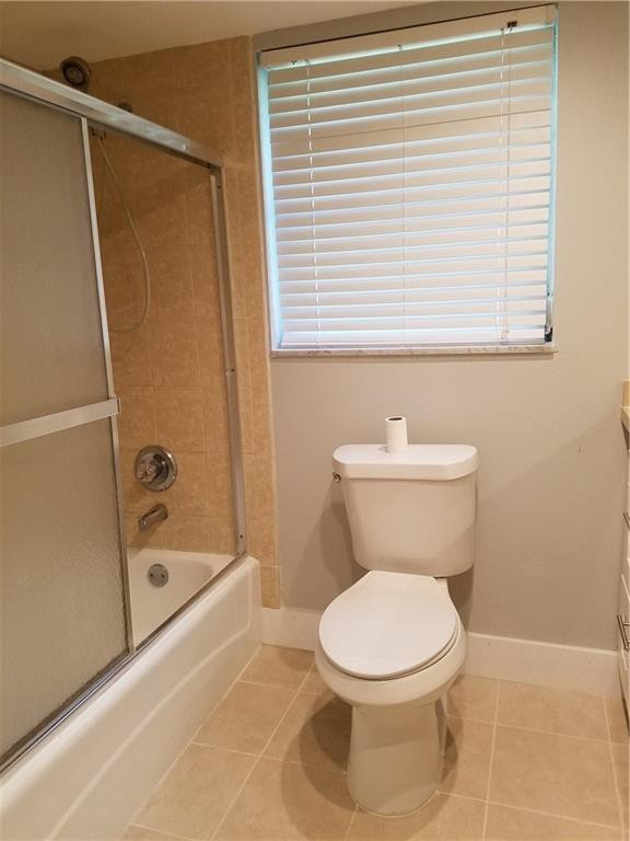 3100 North Course Lane, Unit 210 Pompano Beach, FL 33069 - Photo 19 of 28 a white toilet sitting next to a bath tub