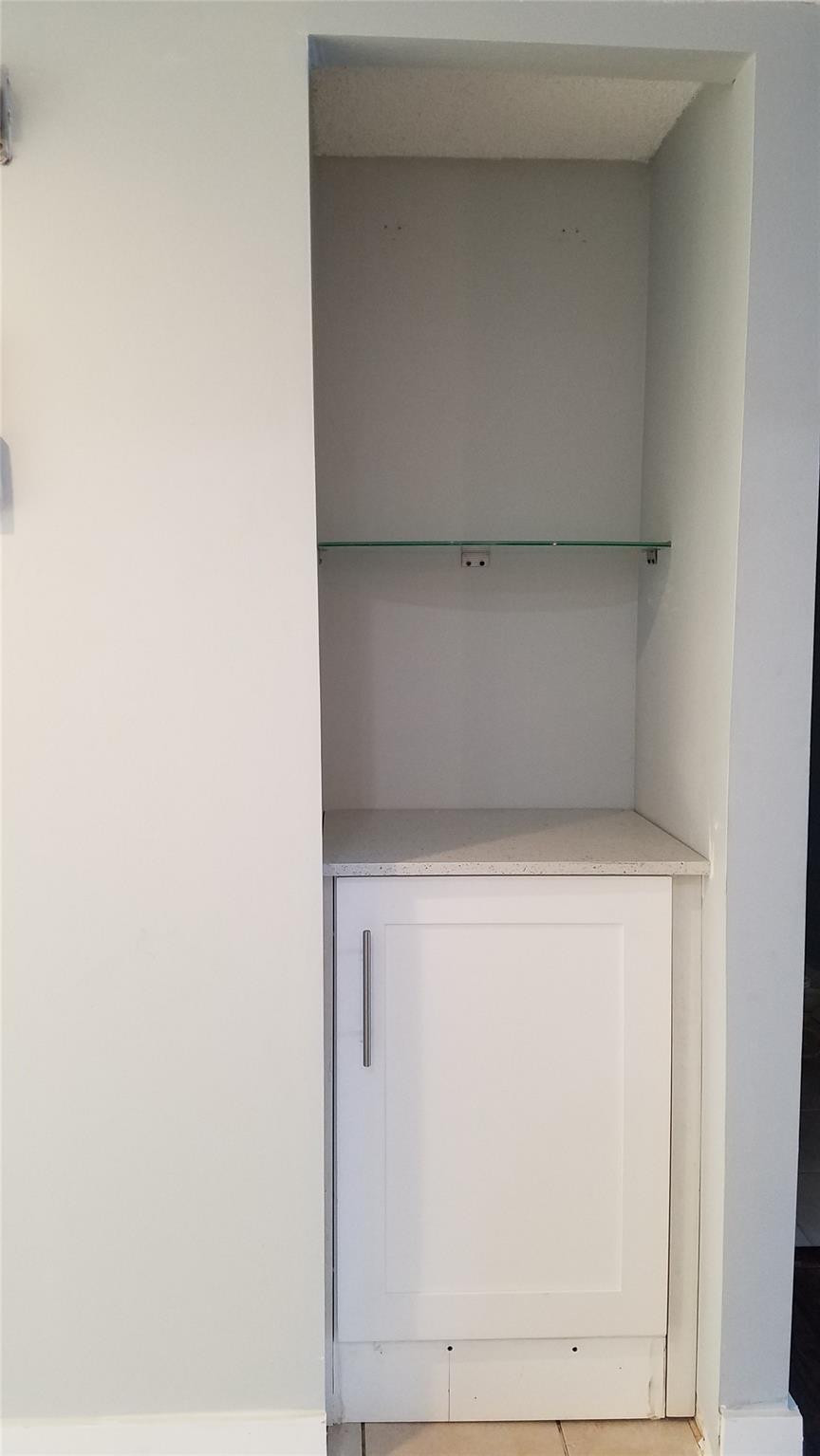 3100 North Course Lane, Unit 210 Pompano Beach, FL 33069 - Photo 7 of 28 a utility room with a washer dryer