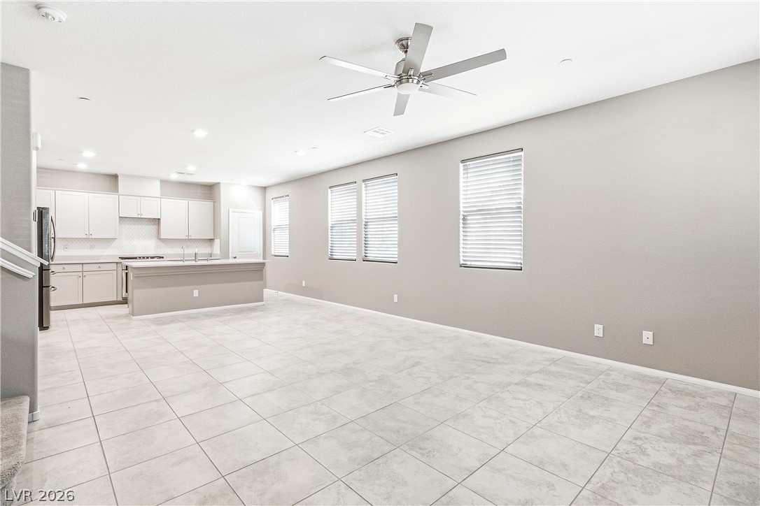2834 Turnstone Ridge Street Henderson, NV 89044 - Photo 20 of 22 An open floor plan seamlessly connects the tiled living space directly to the kitchen.