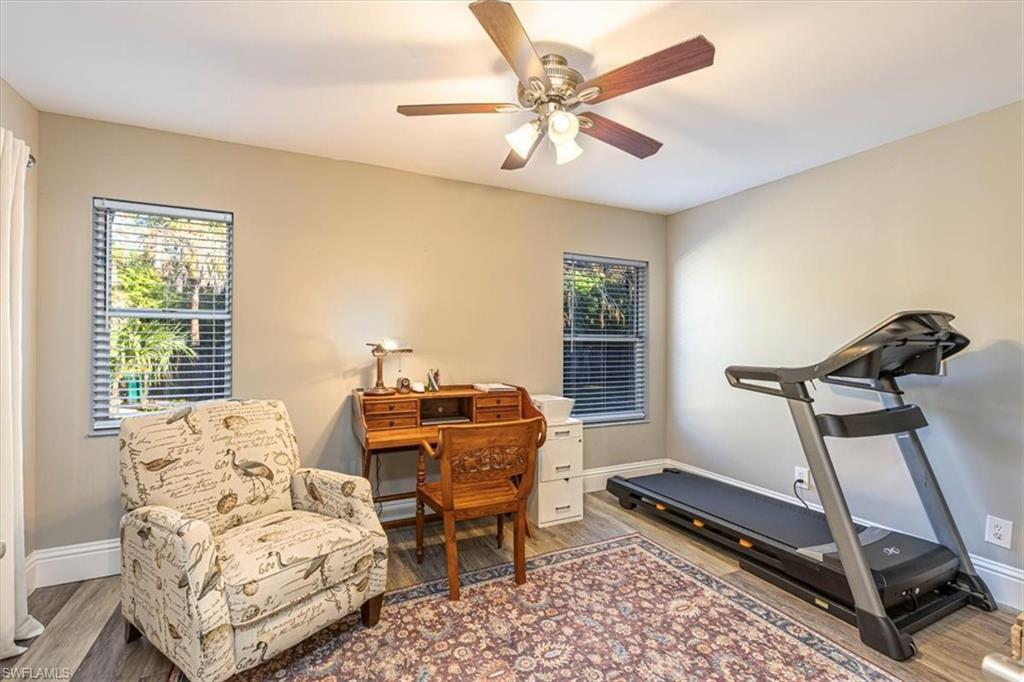 960 21st Street Southwest Naples, FL 34117 - Photo 11 of 33 a bedroom with furniture and a window