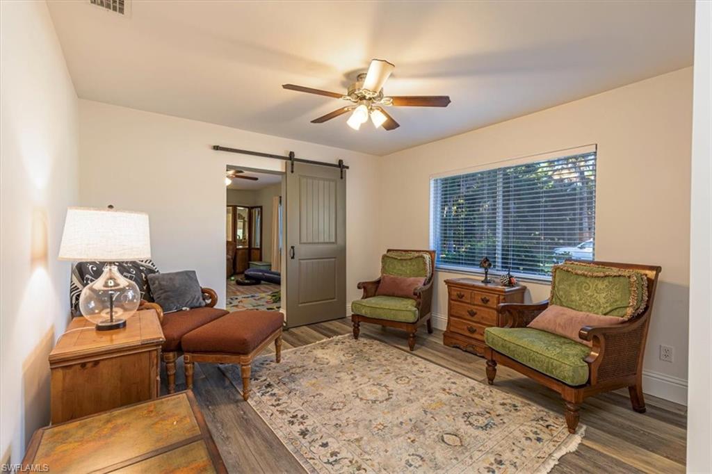 960 21st Street Southwest Naples, FL 34117 - Photo 17 of 33 a living room with furniture and a large window