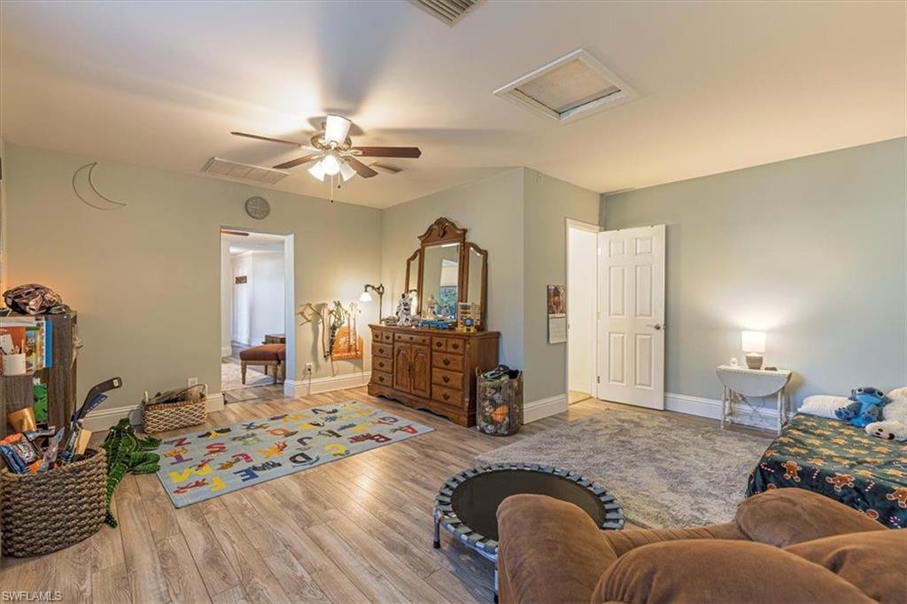960 21st Street Southwest Naples, FL 34117 - Photo 20 of 33 a living room with furniture and wooden floor