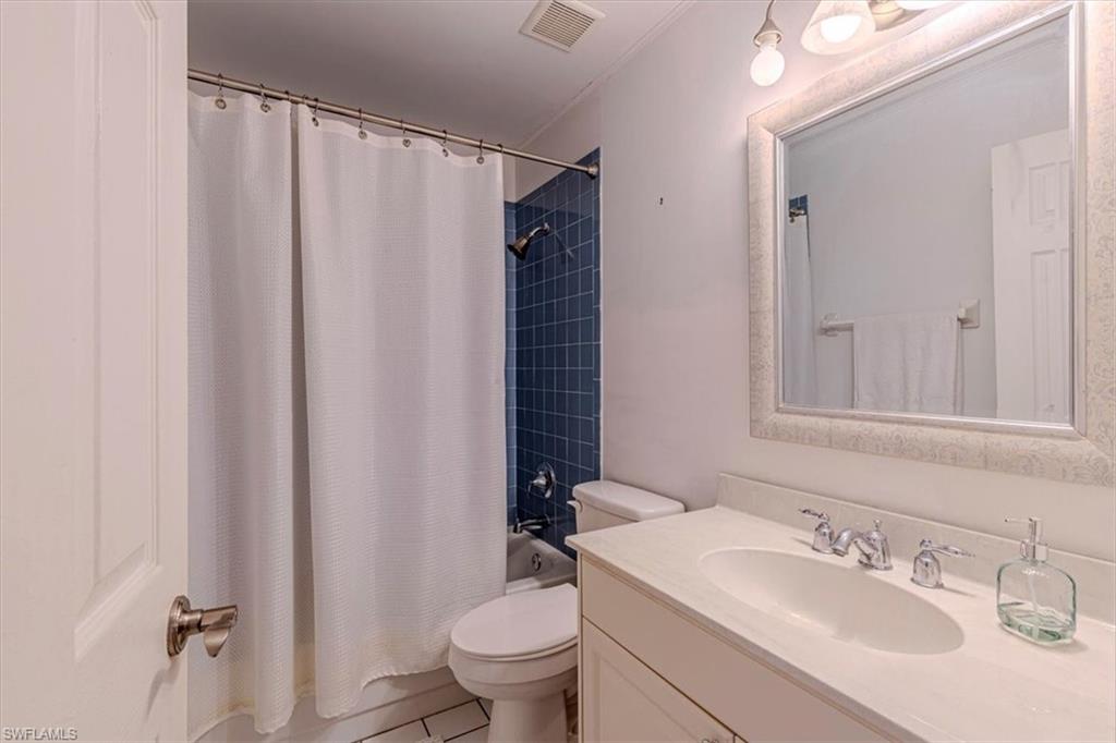 960 21st Street Southwest Naples, FL 34117 - Photo 22 of 33 a bathroom with a sink a toilet and shower