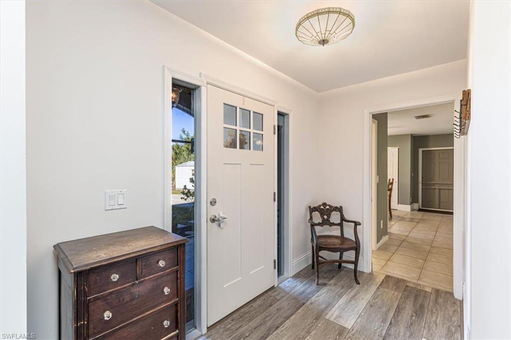 960 21st Street Southwest Naples, FL 34117 - Photo 26 of 33 a view of a hallway to a livingroom with furniture
